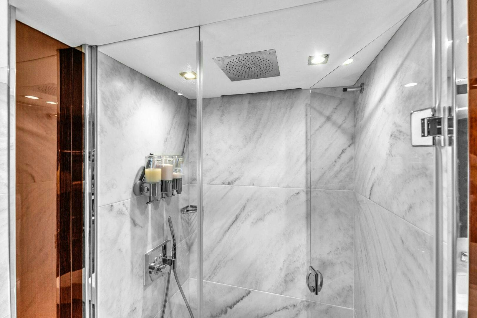 a shower with a tile floor aboard KARILLIAN & COMPANY Yacht for Sale