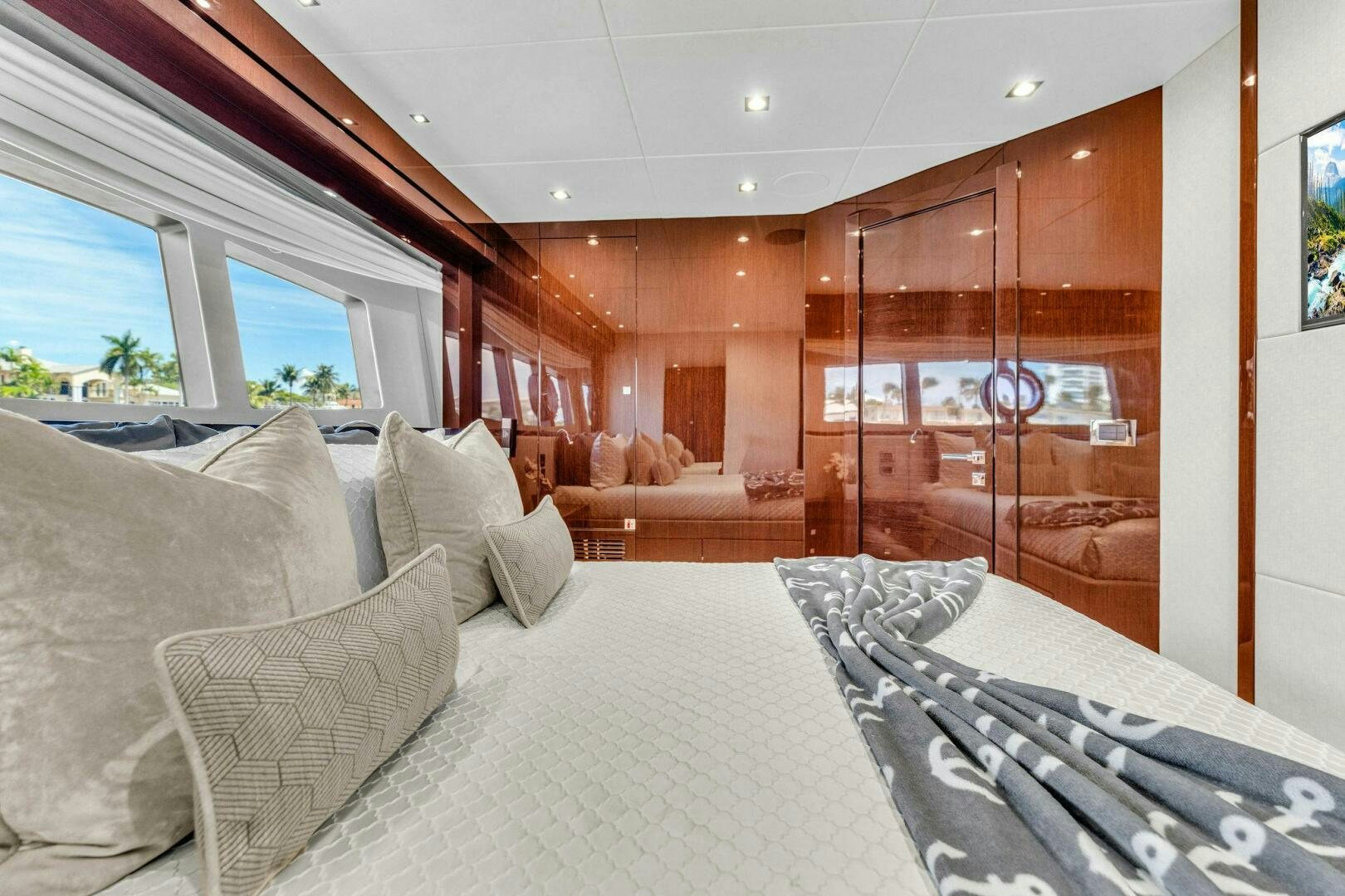 a large room with a bed and a large window aboard KARILLIAN & COMPANY Yacht for Sale