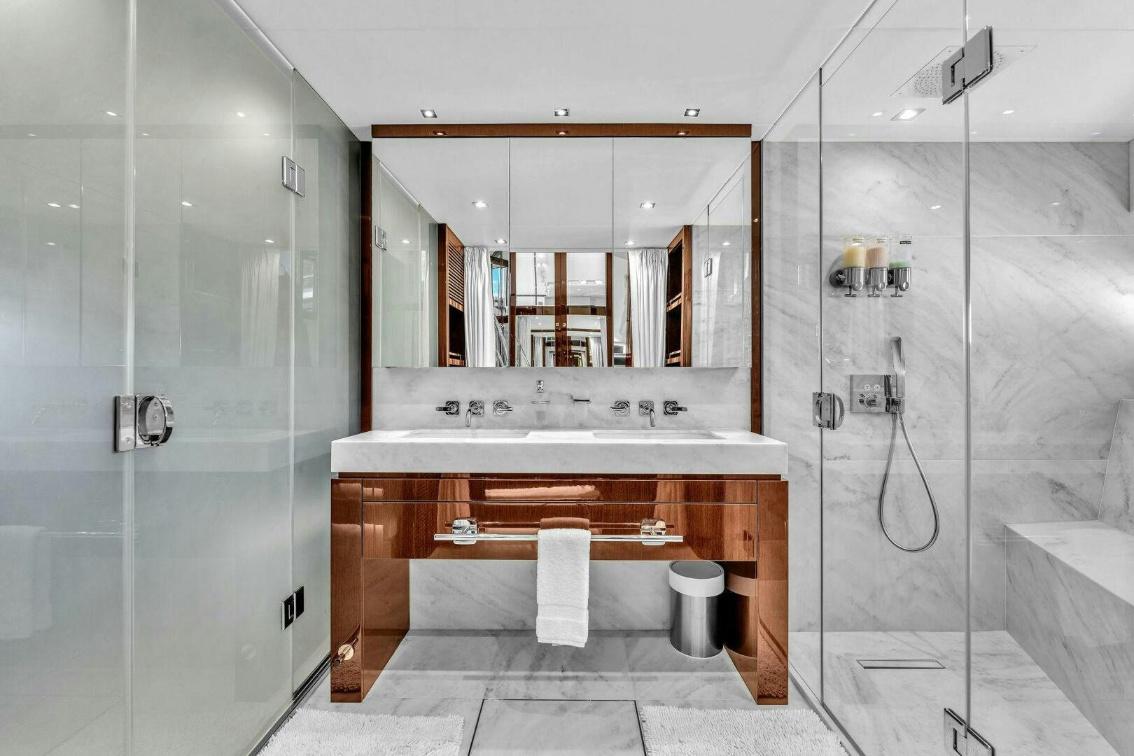 a bathroom with a large mirror aboard KARILLIAN & COMPANY Yacht for Sale