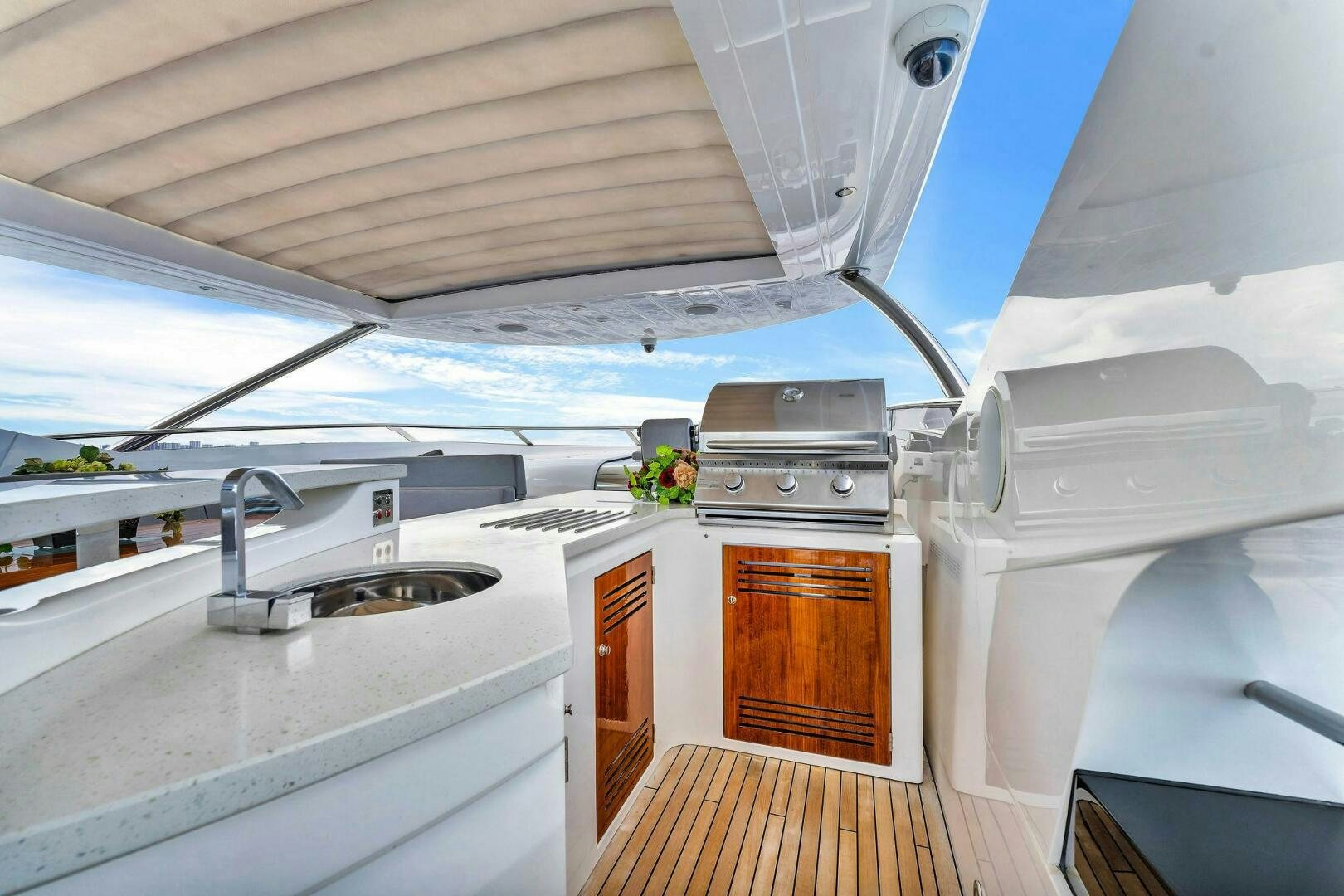 a small kitchen with a large window aboard KARILLIAN & COMPANY Yacht for Sale