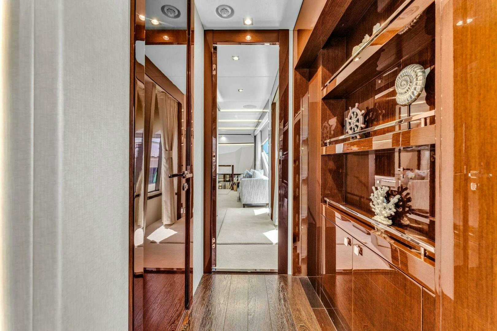 a hallway with a wood floor aboard KARILLIAN & COMPANY Yacht for Sale
