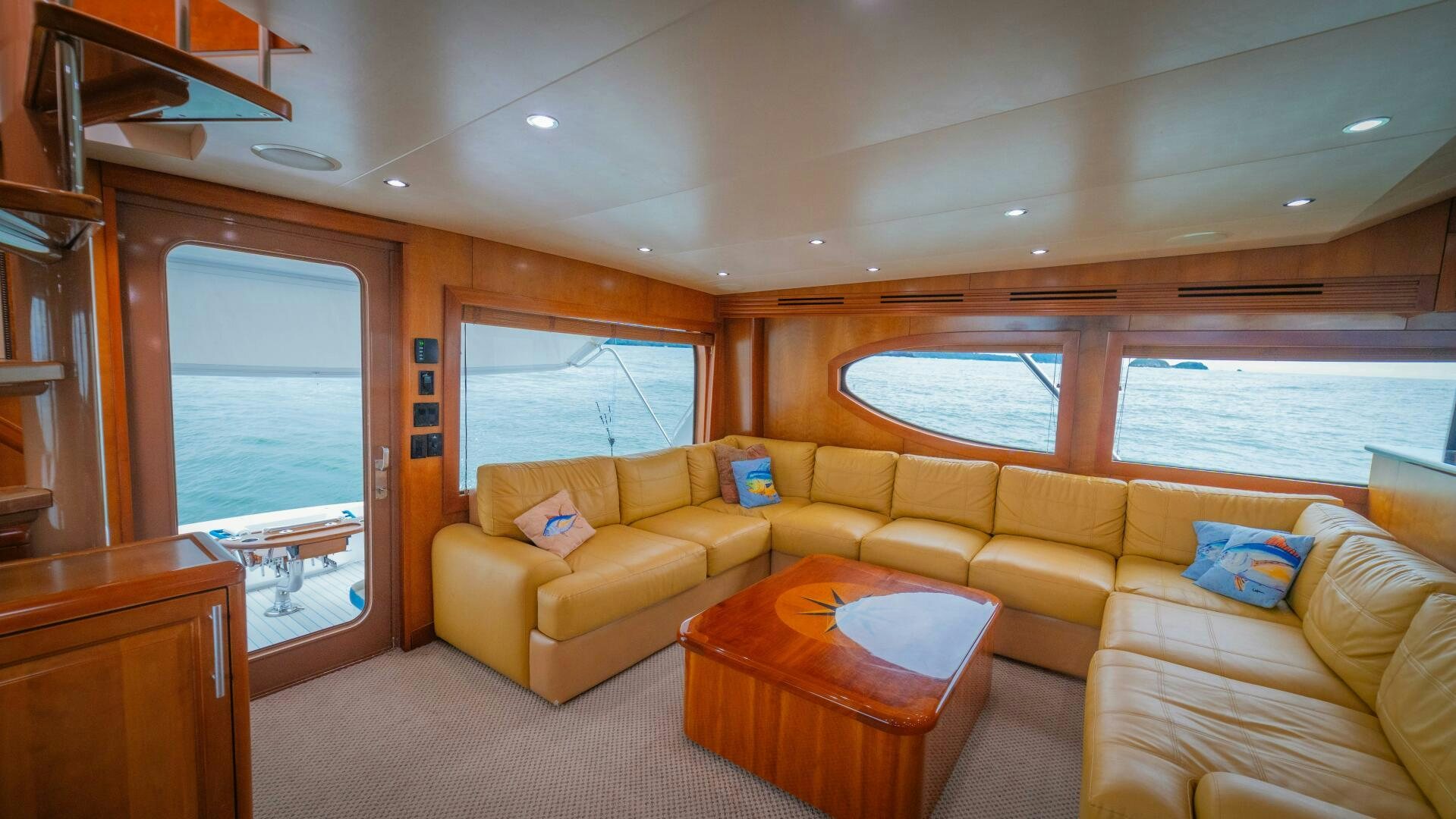 a living room with a couch and a table aboard MARLIN CLIPPER Yacht for Sale