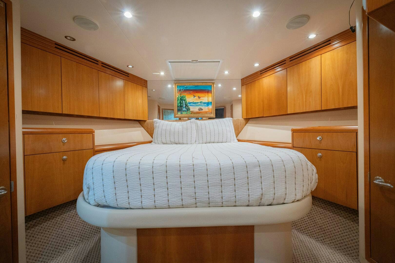 a bedroom with a large white bed aboard MARLIN CLIPPER Yacht for Sale