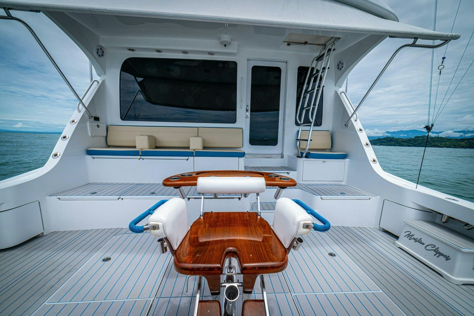 a boat with a seat and a steering wheel on the deck aboard MARLIN CLIPPER Yacht for Sale