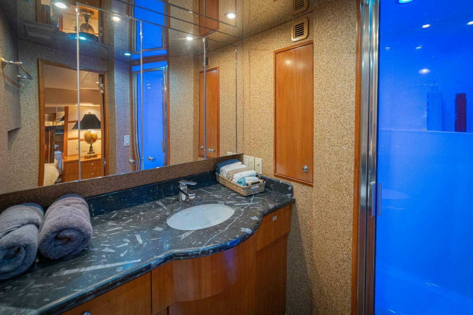 a bathroom with a countertop sink aboard MARLIN CLIPPER Yacht for Sale