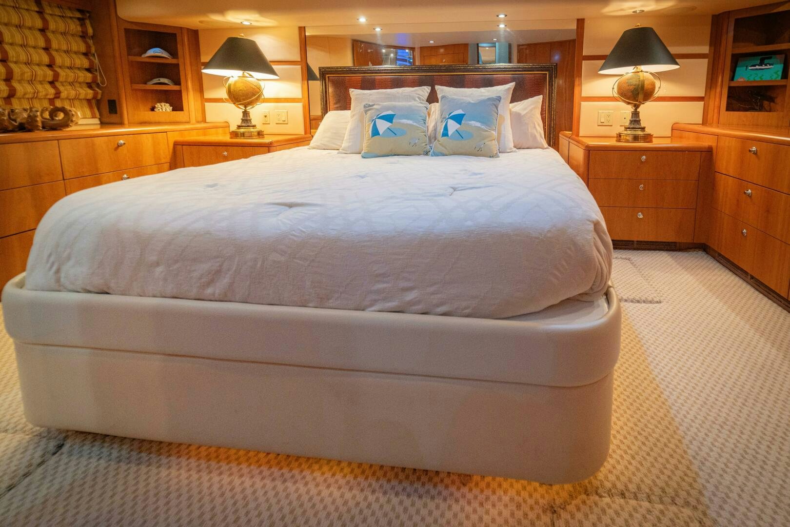 a bed with a white comforter aboard MARLIN CLIPPER Yacht for Sale