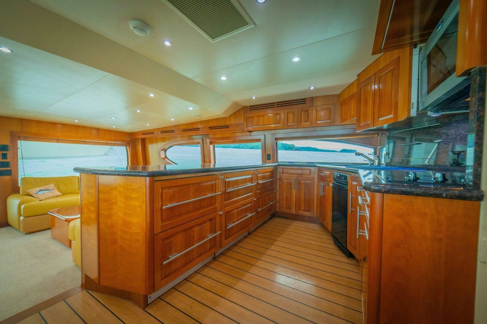 a large kitchen with wooden cabinets aboard MARLIN CLIPPER Yacht for Sale