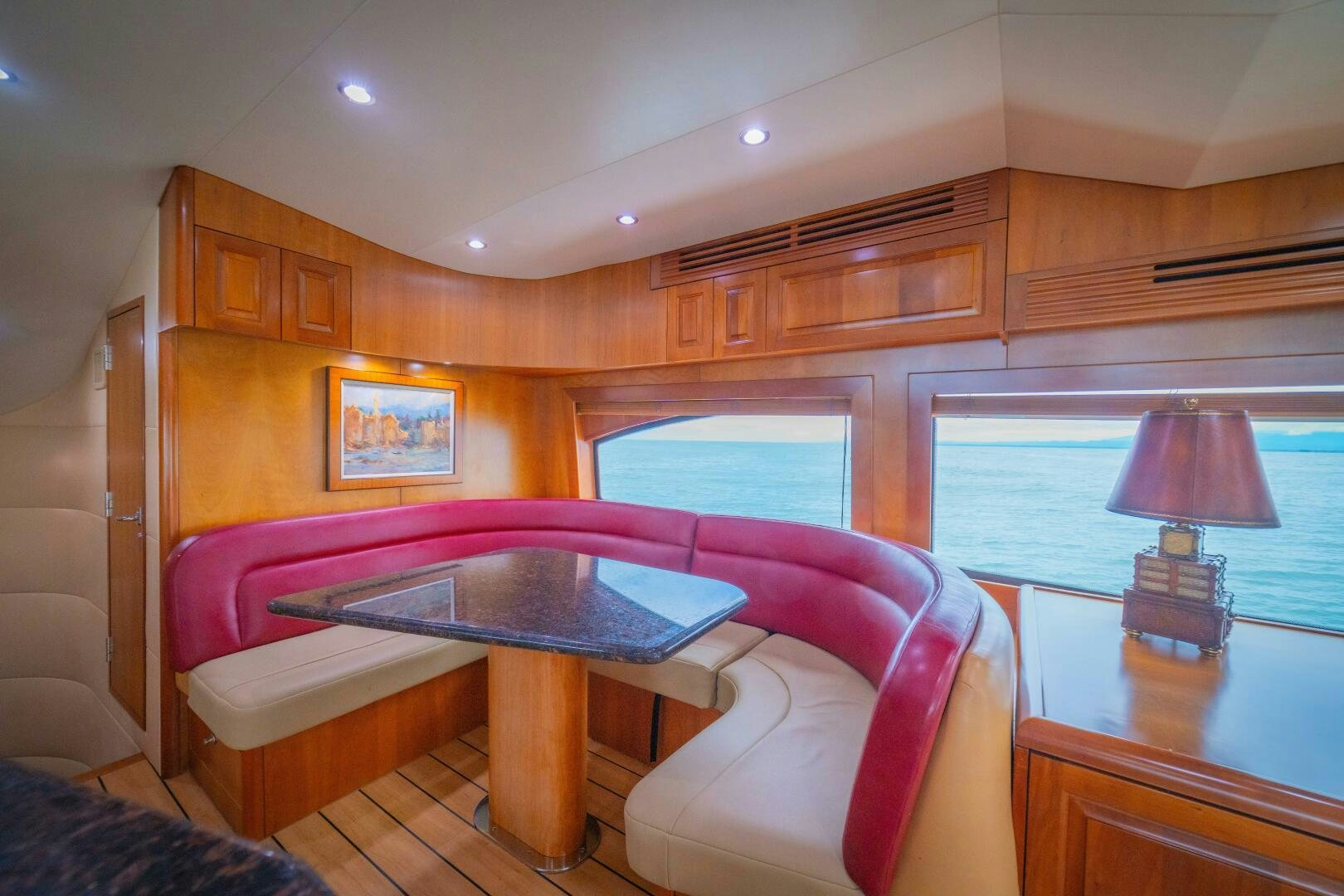 a living room with a table and a couch aboard MARLIN CLIPPER Yacht for Sale