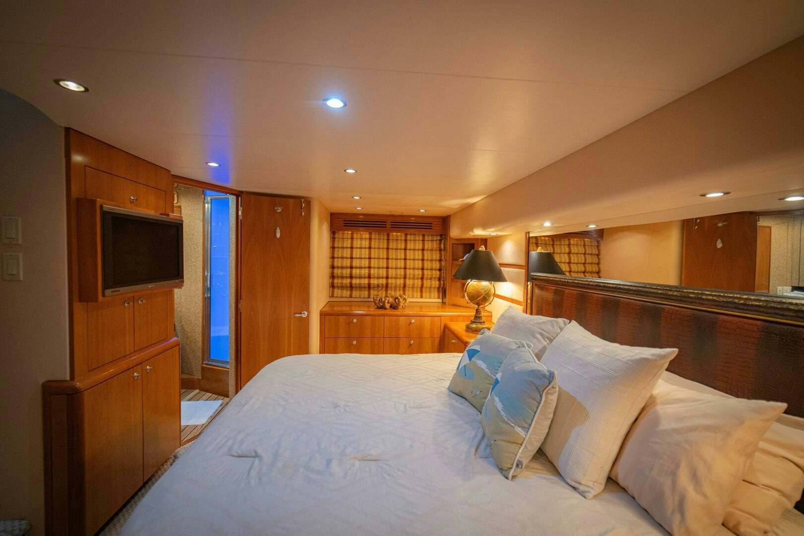 a bed with white sheets and pillows aboard MARLIN CLIPPER Yacht for Sale
