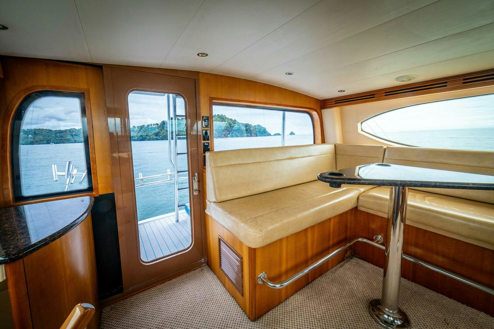 a room with a couch and a table aboard MARLIN CLIPPER Yacht for Sale