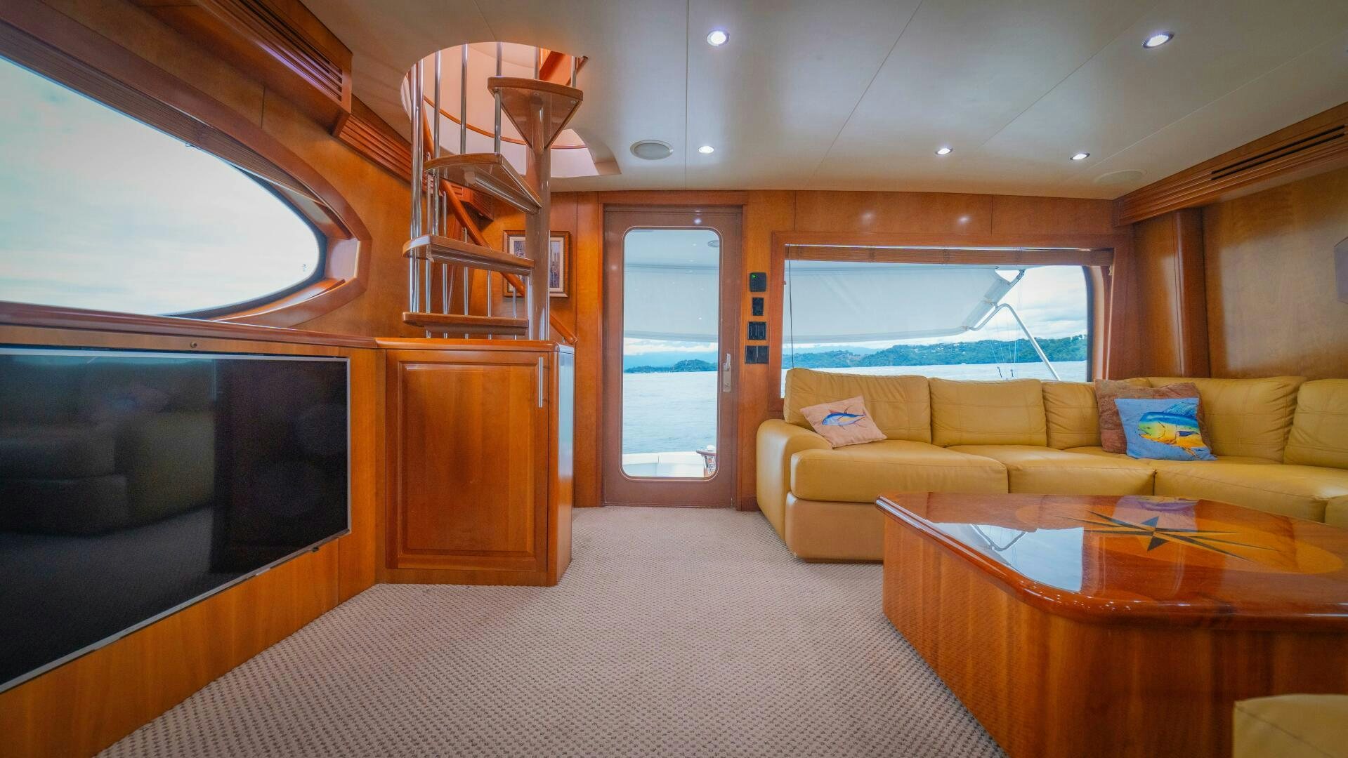 a living room with a large window aboard MARLIN CLIPPER Yacht for Sale