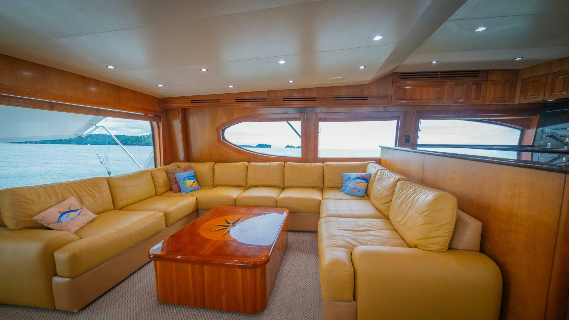 a living room with a couch and a table aboard MARLIN CLIPPER Yacht for Sale