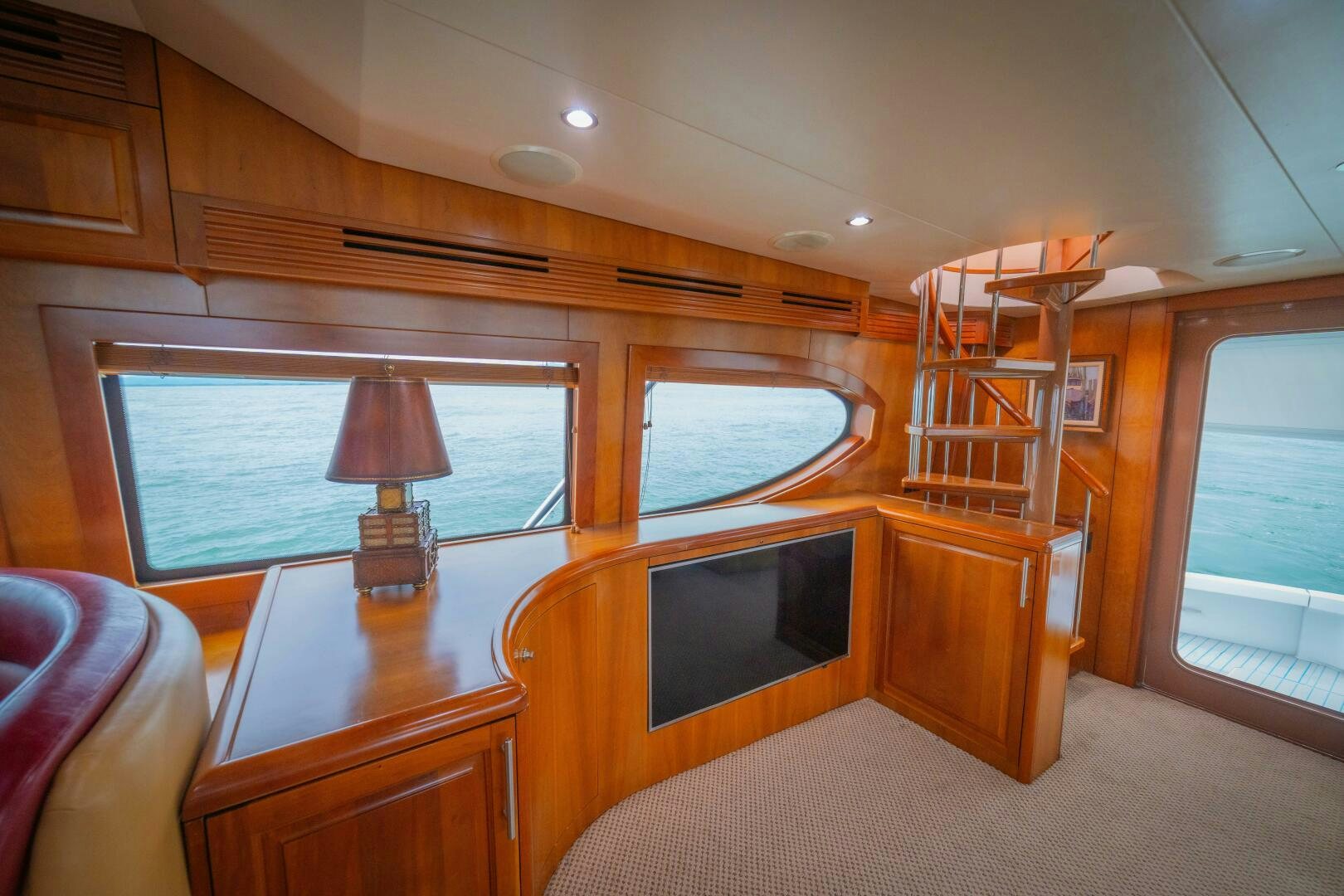a room with a television and a table aboard MARLIN CLIPPER Yacht for Sale