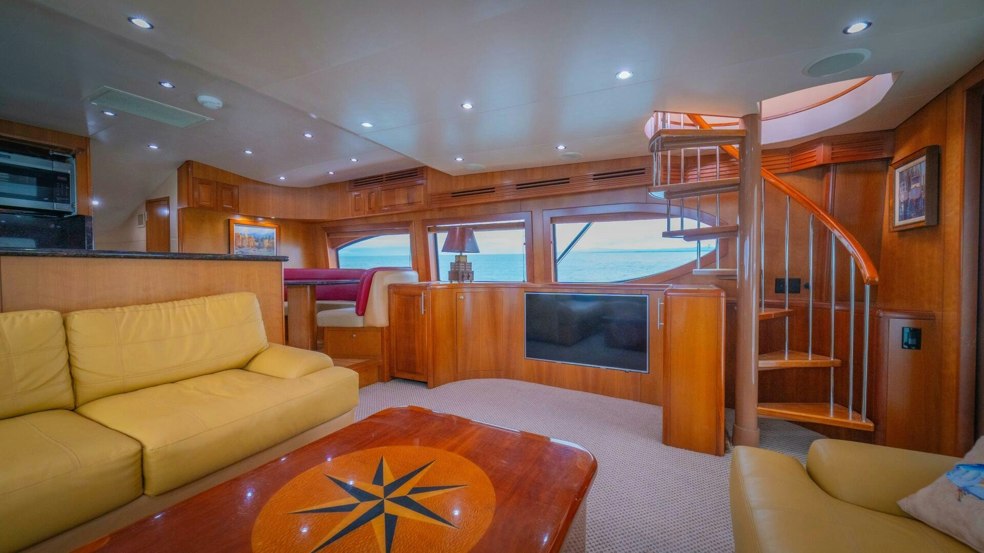 a living room with a large window aboard MARLIN CLIPPER Yacht for Sale