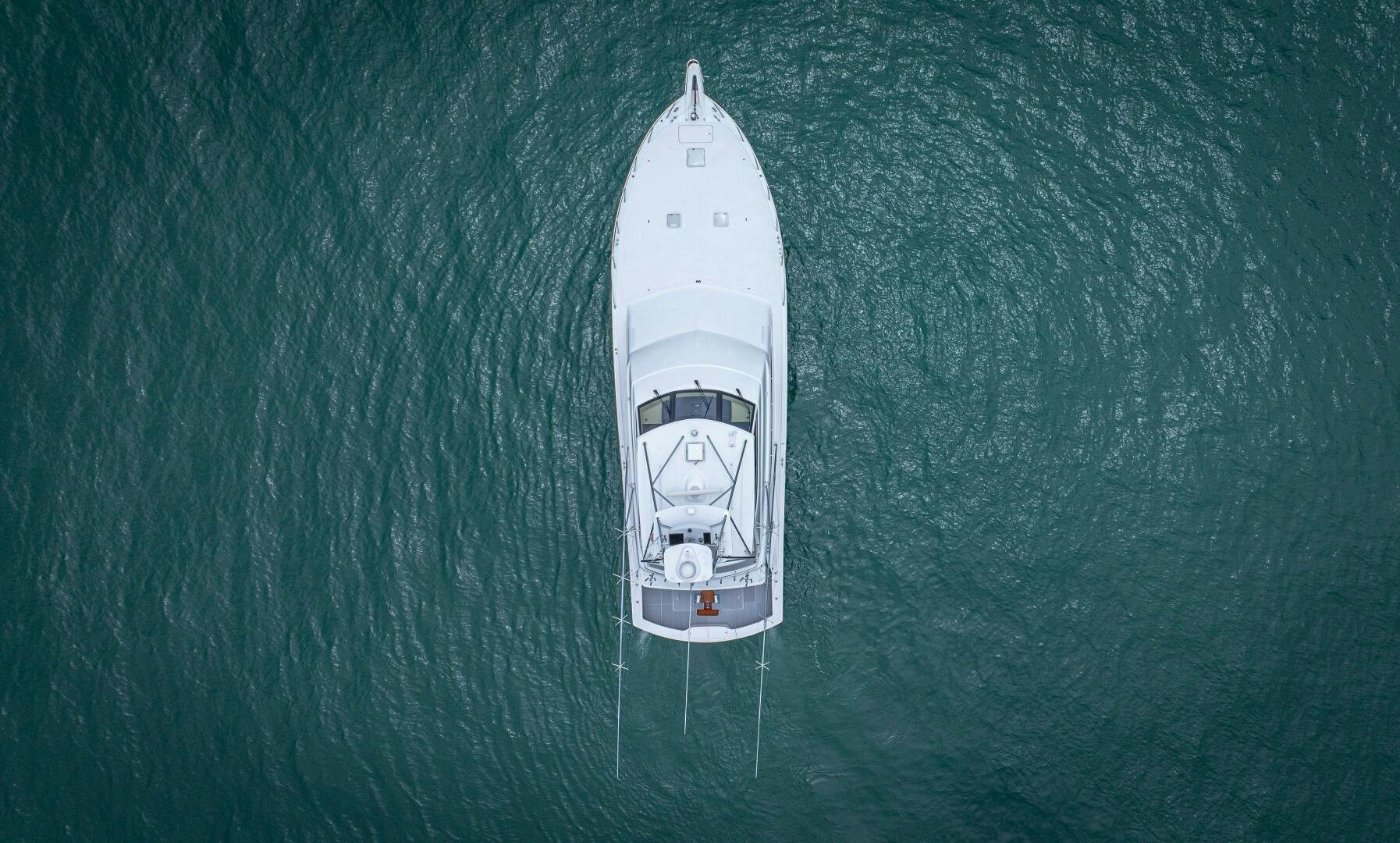 a white boat in the water aboard MARLIN CLIPPER Yacht for Sale