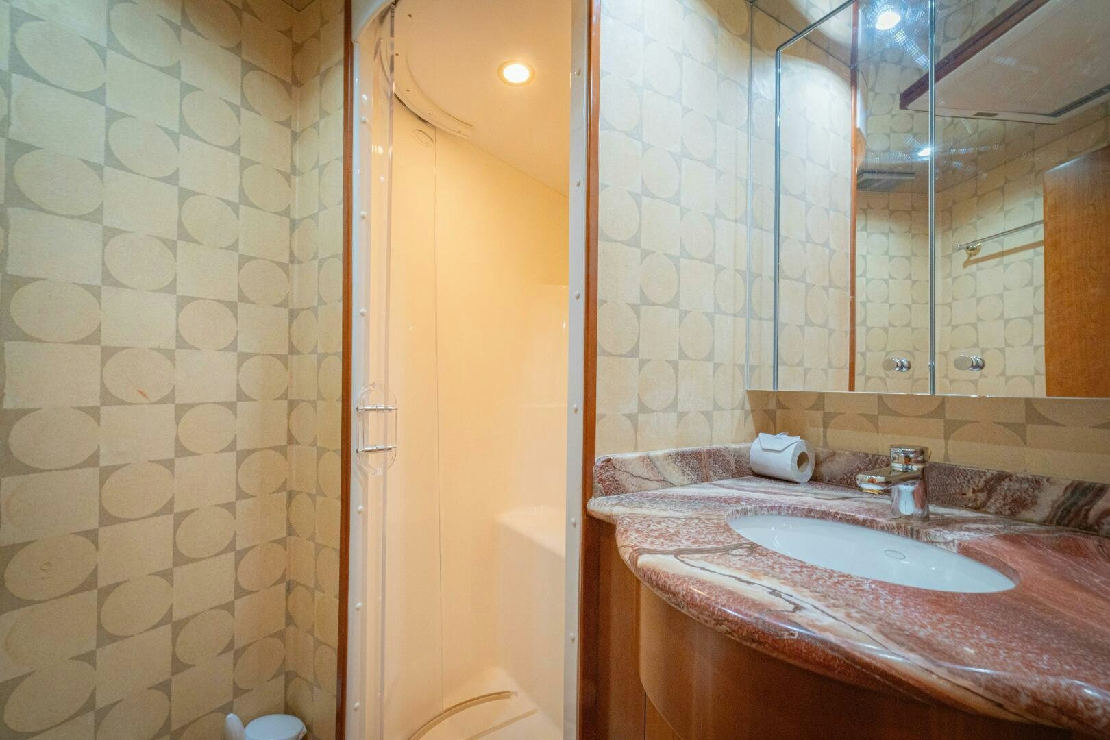 a bathroom with a sink and a mirror aboard MARLIN CLIPPER Yacht for Sale