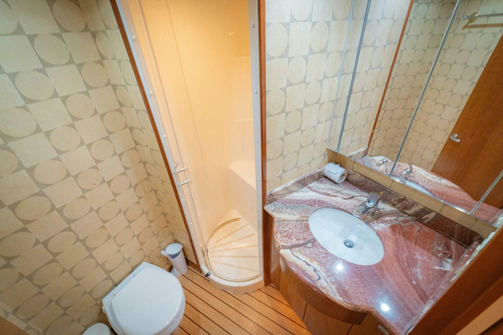 a bathroom with a sink and a toilet aboard MARLIN CLIPPER Yacht for Sale