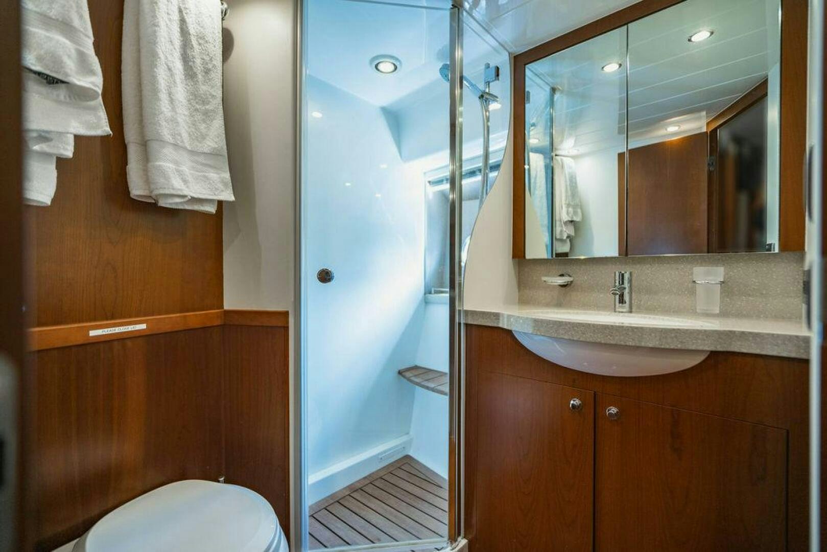 a bathroom with a sink and a mirror aboard EMPIRE SUN Yacht for Sale
