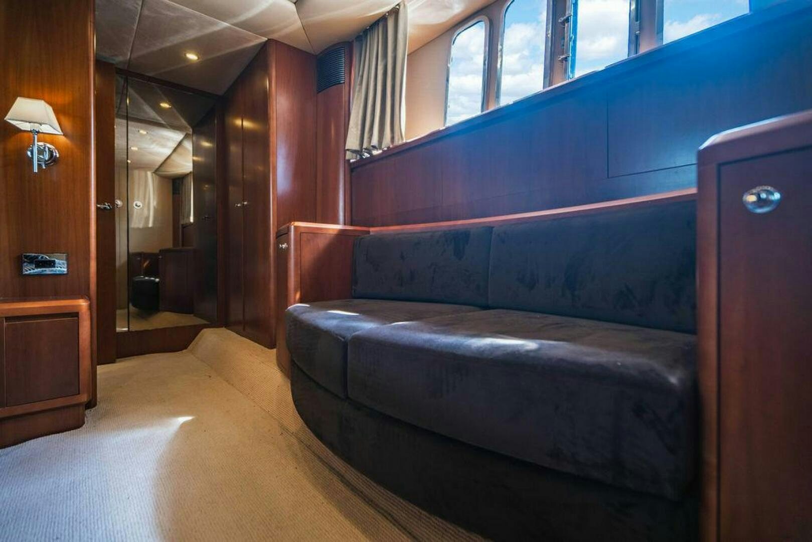 a couch in a room aboard EMPIRE SUN Yacht for Sale