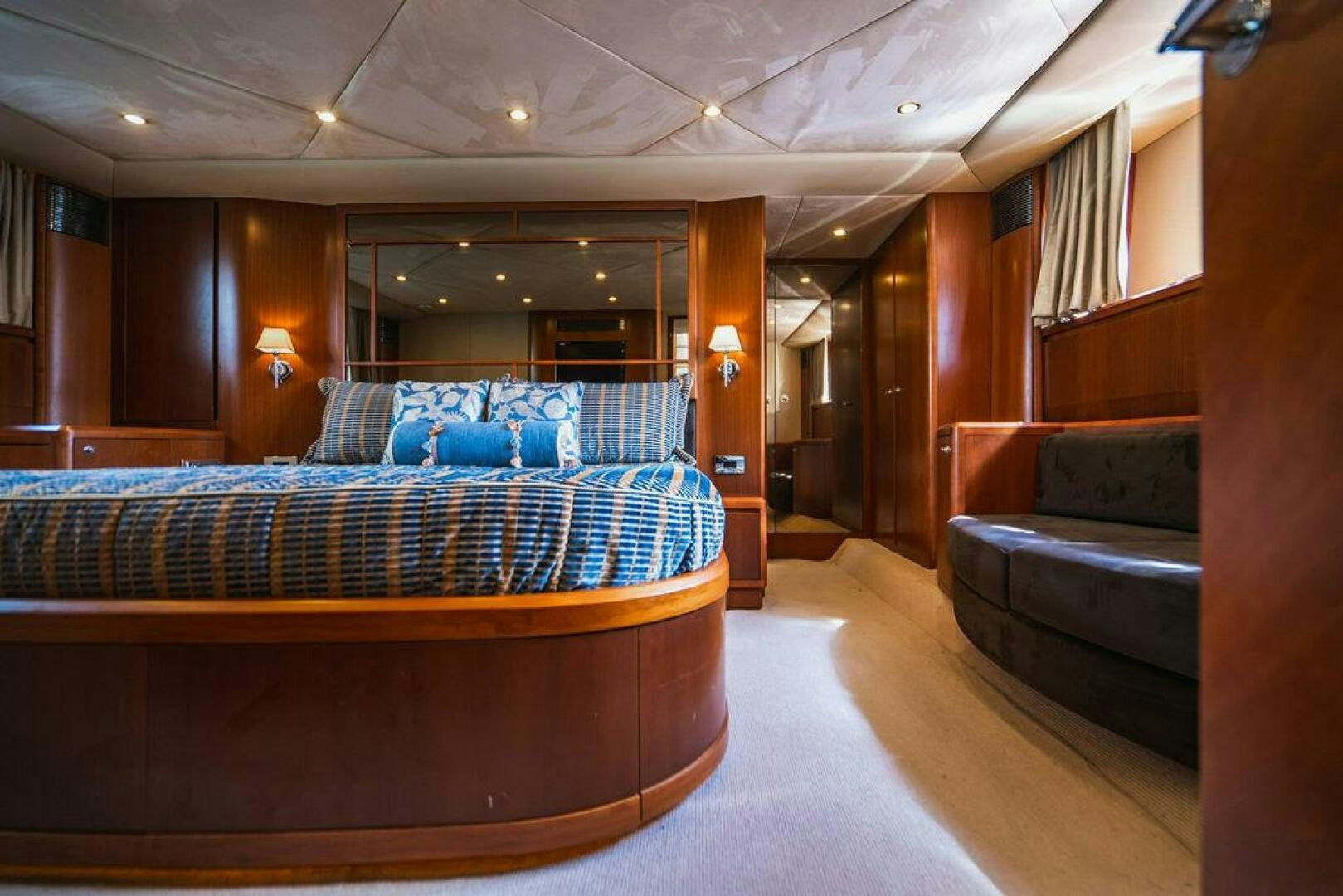 a bed in a room aboard EMPIRE SUN Yacht for Sale