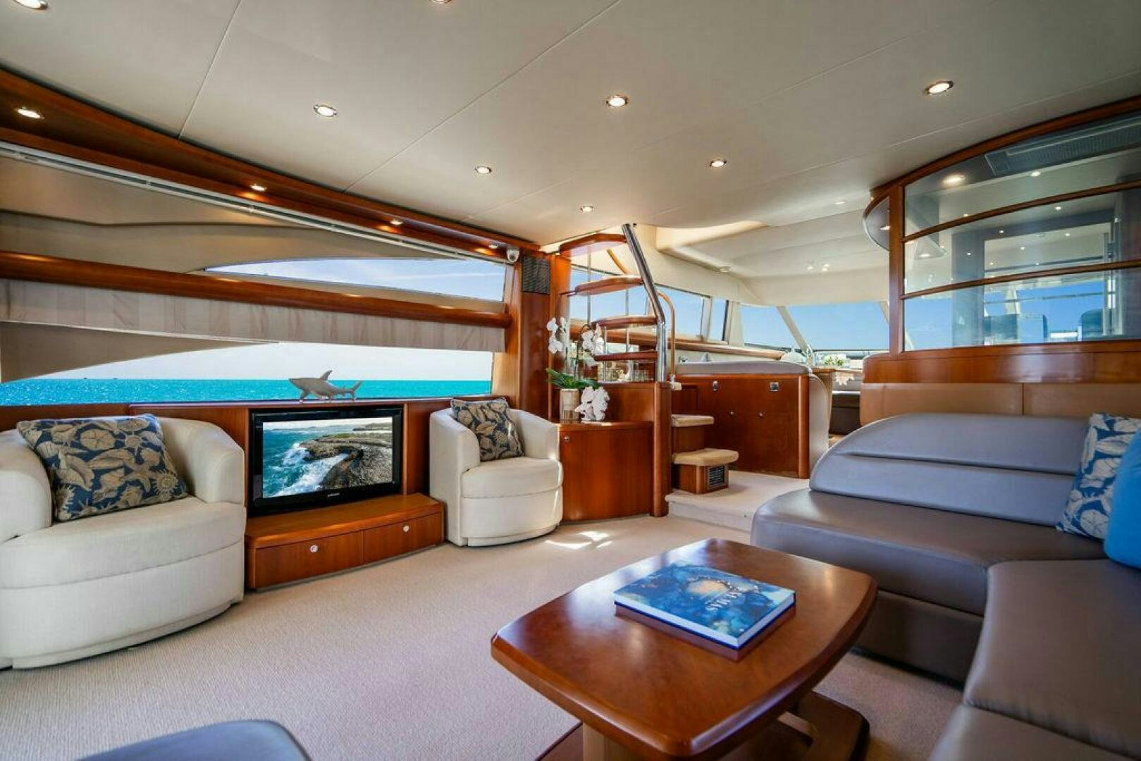 a living room with a large bed aboard EMPIRE SUN Yacht for Sale