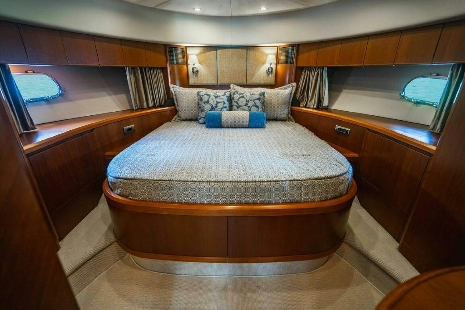 a bed in a room aboard EMPIRE SUN Yacht for Sale