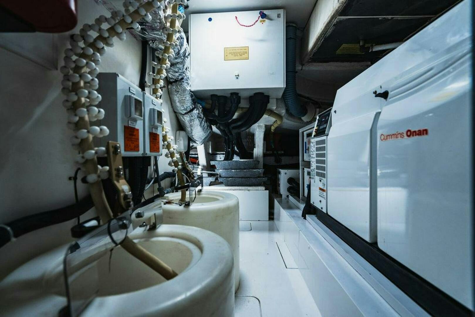 a bathroom with pipes and equipment aboard EMPIRE SUN Yacht for Sale
