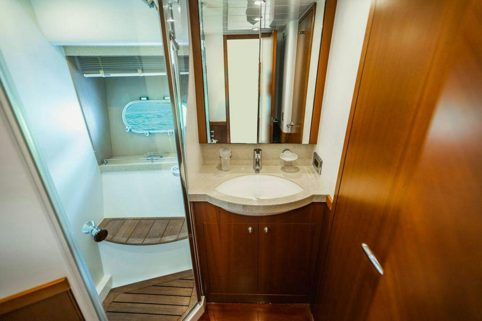 a bathroom with a glass shower aboard EMPIRE SUN Yacht for Sale