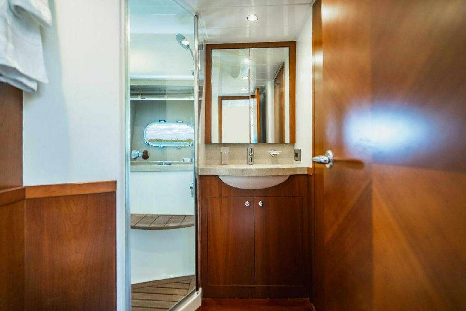 a bathroom with a glass shower aboard EMPIRE SUN Yacht for Sale