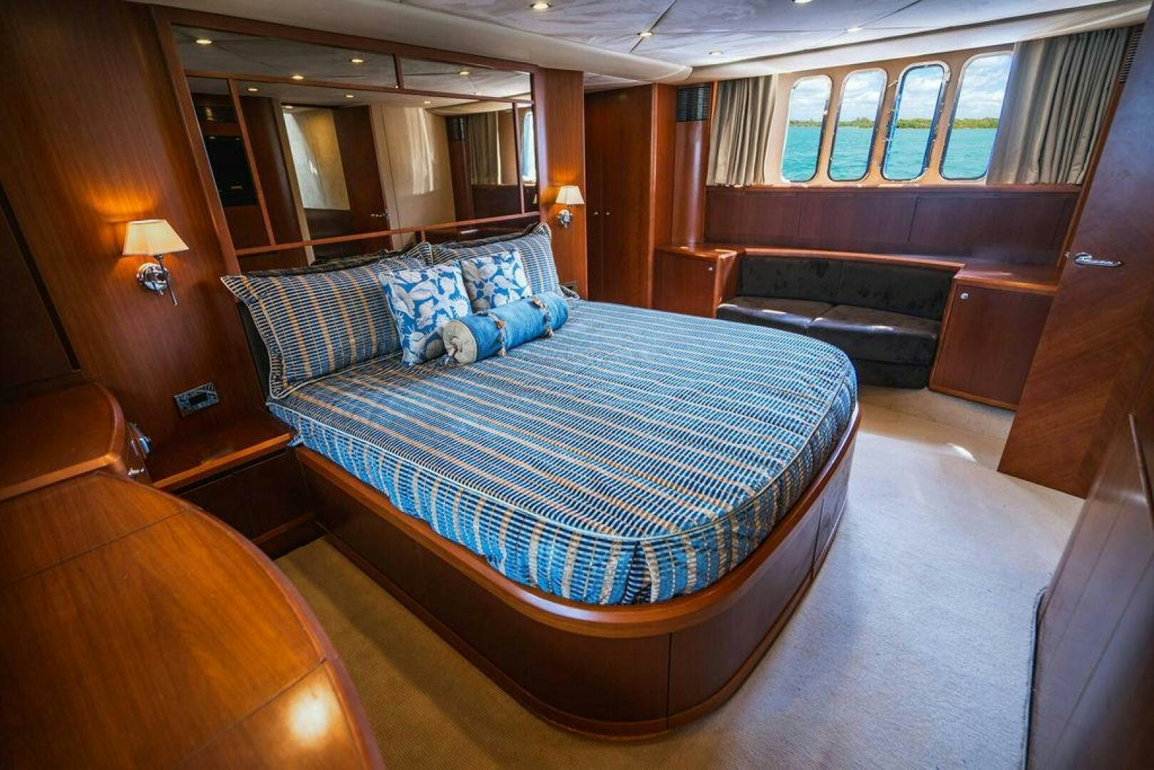 a large bed in a room aboard EMPIRE SUN Yacht for Sale