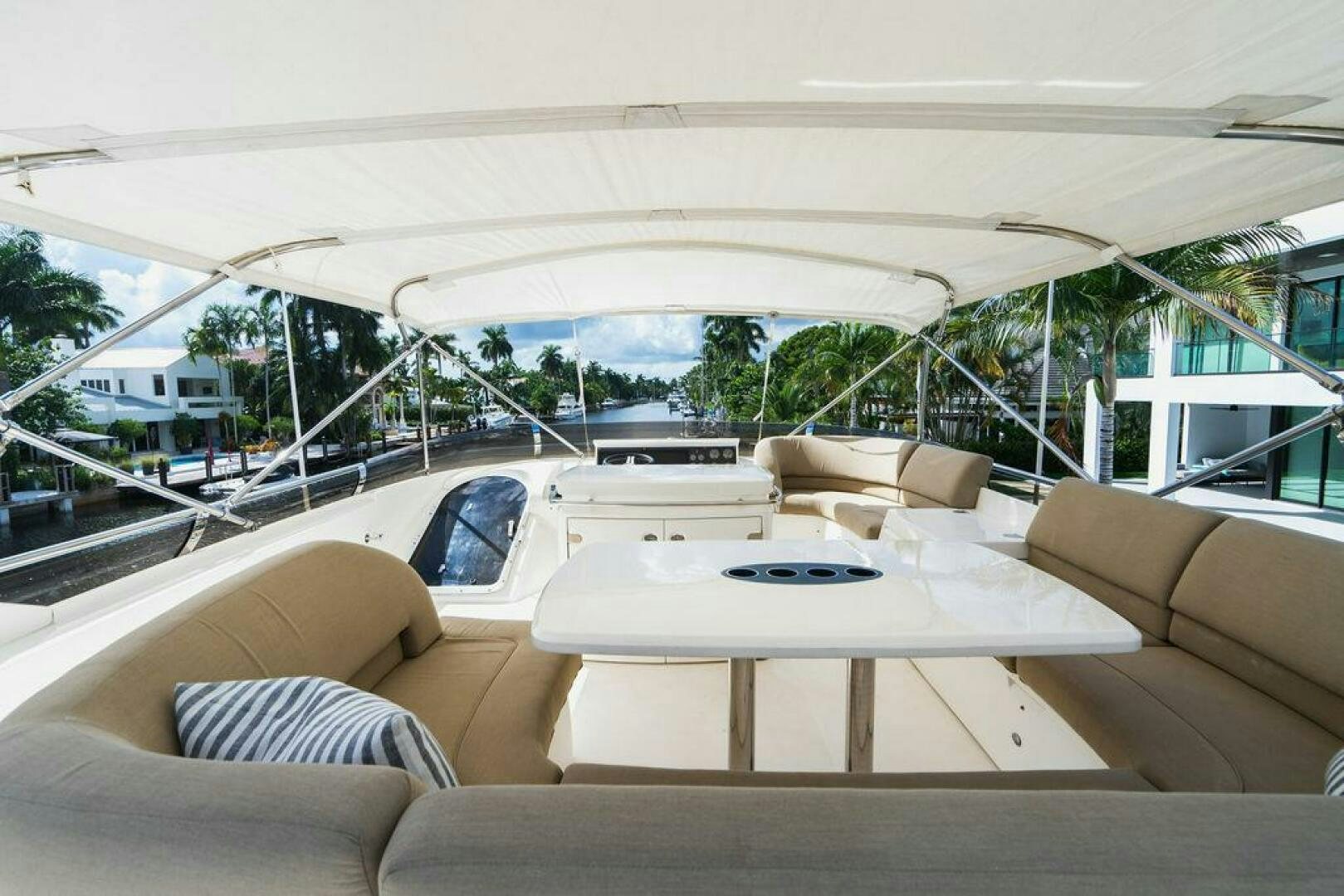 a tent with a table and couch aboard EMPIRE SUN Yacht for Sale
