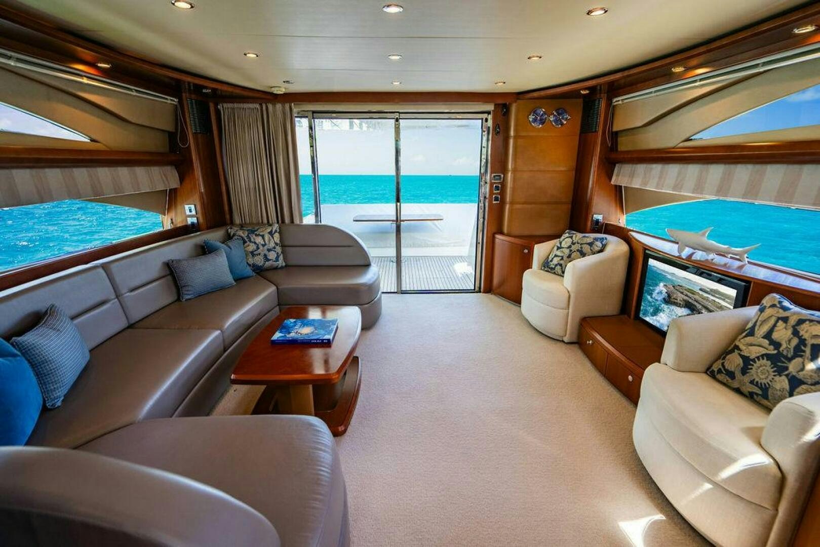 a living room with a large window aboard EMPIRE SUN Yacht for Sale