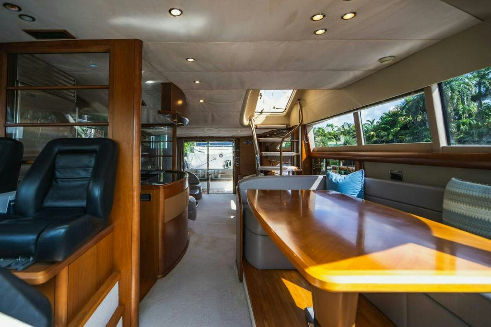 a room with a table and chairs aboard EMPIRE SUN Yacht for Sale