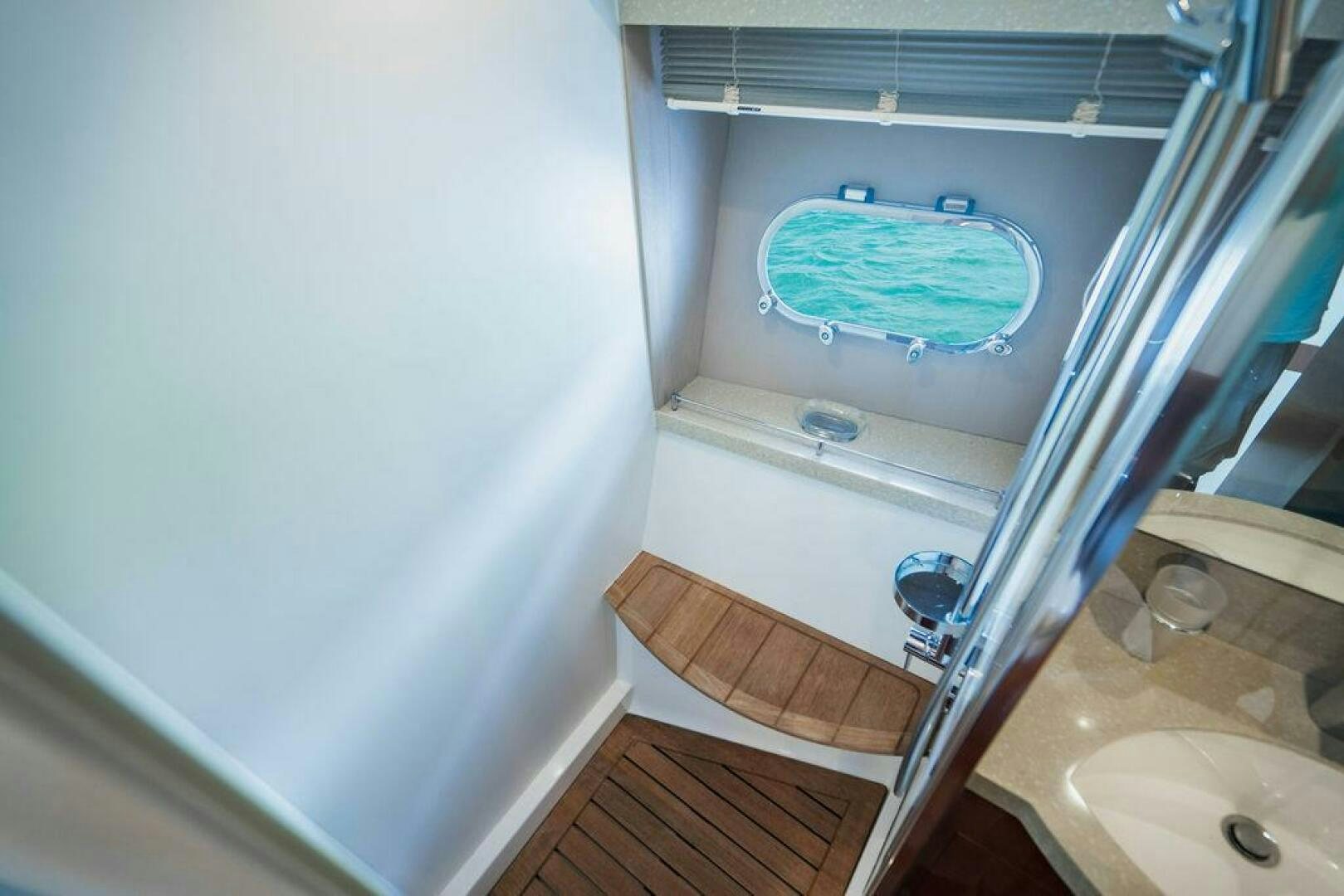 a bathroom with a glass shower aboard EMPIRE SUN Yacht for Sale