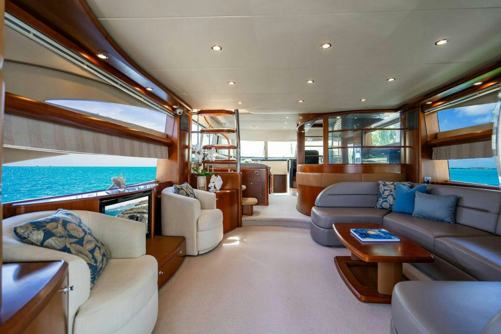 a living room with a large swimming pool aboard EMPIRE SUN Yacht for Sale