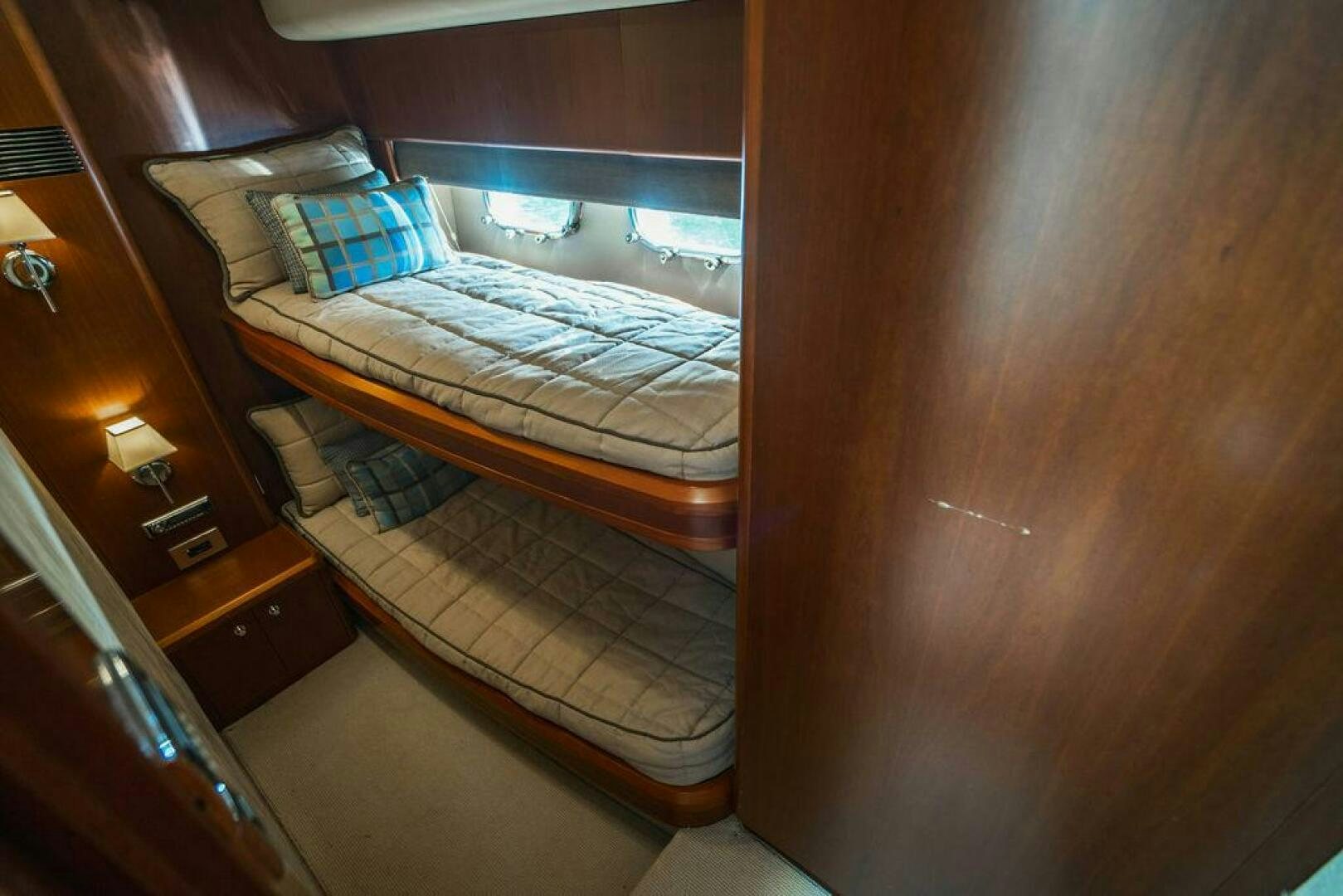 a bed in a room aboard EMPIRE SUN Yacht for Sale