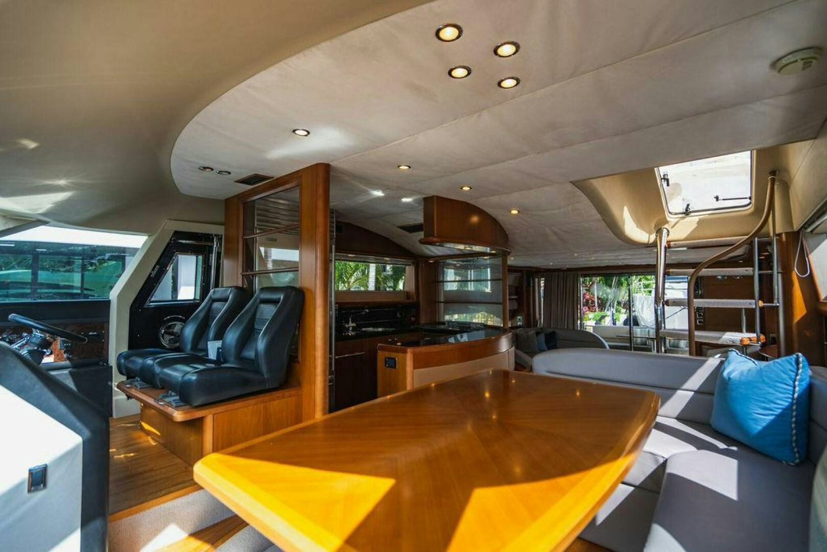 a room with a table and couch aboard EMPIRE SUN Yacht for Sale