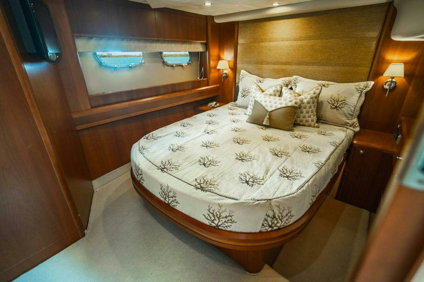 a bed with a white sheet aboard EMPIRE SUN Yacht for Sale