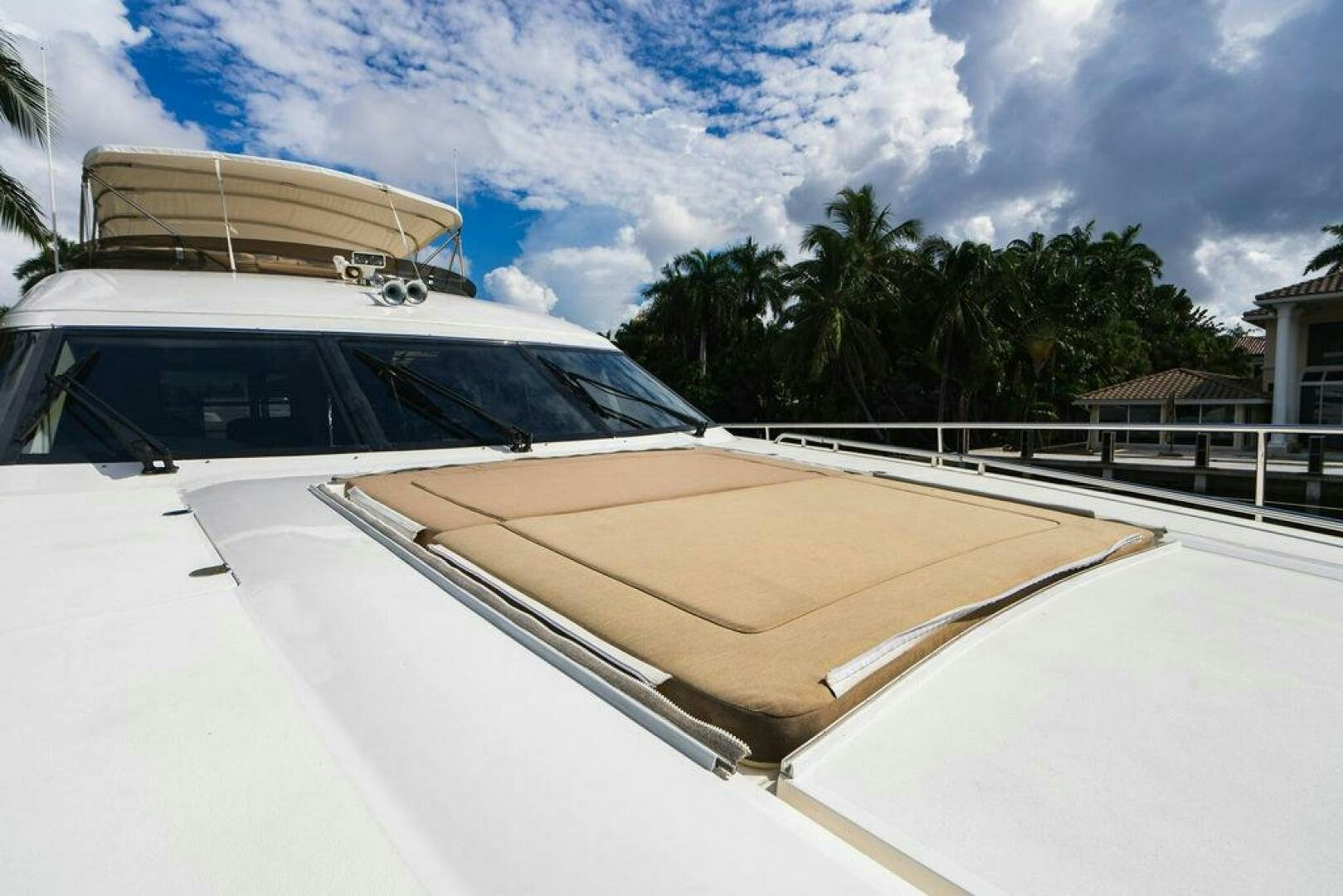 a white car parked on a road aboard EMPIRE SUN Yacht for Sale