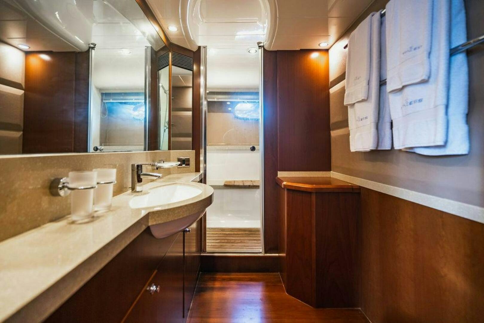 a bathroom with a sink and a mirror aboard EMPIRE SUN Yacht for Sale