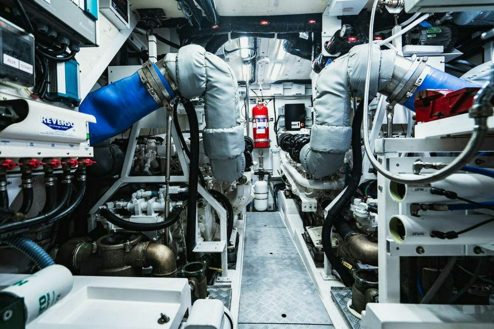 a person working on a machine aboard EMPIRE SUN Yacht for Sale