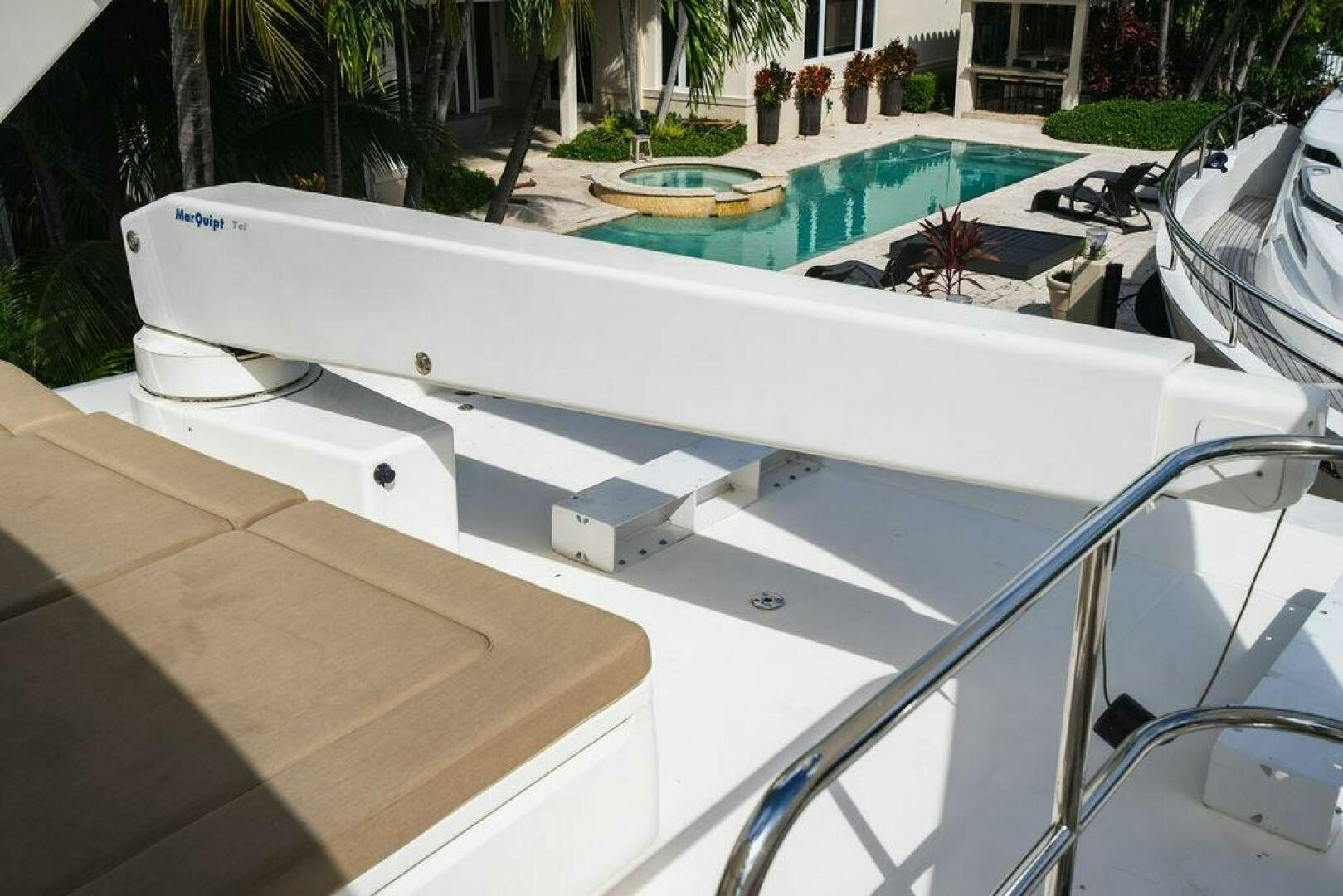 a white boat on a deck aboard EMPIRE SUN Yacht for Sale