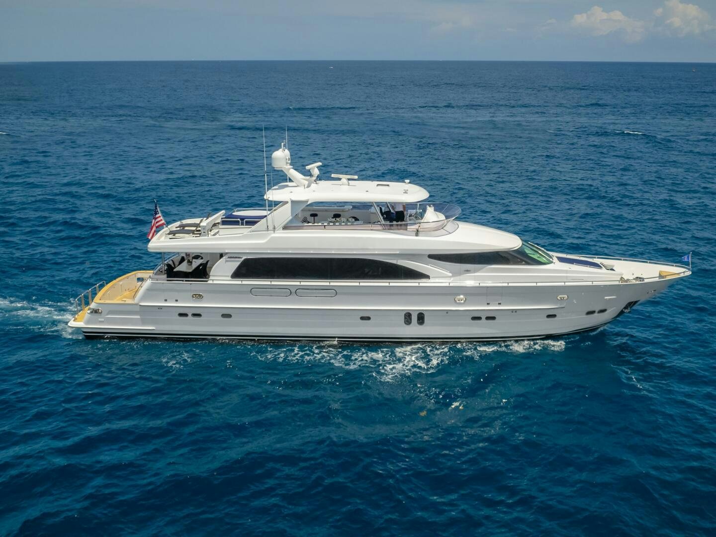 a white yacht in the water aboard BAD DADDY Yacht for Sale