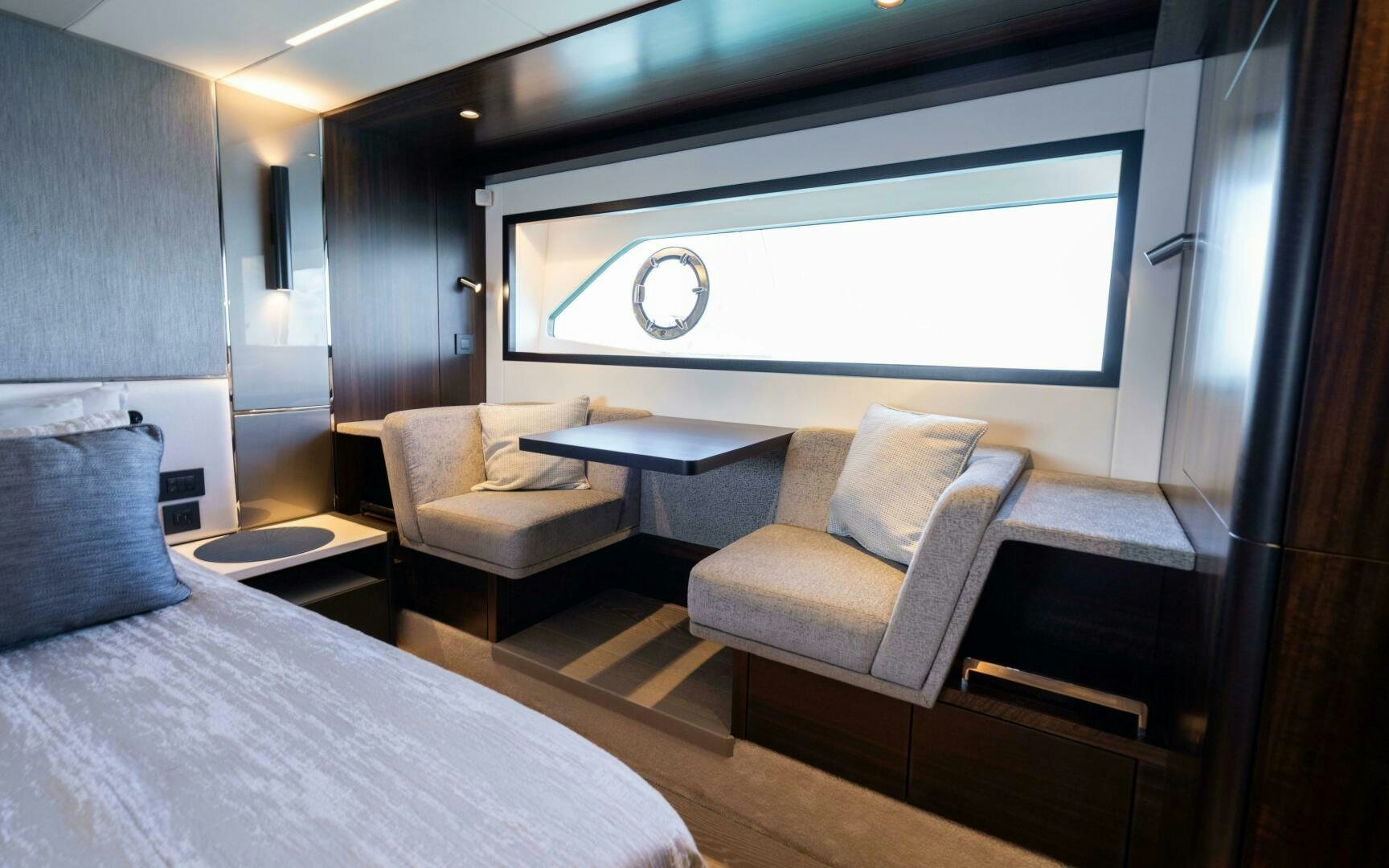 a room with a bed and a table aboard 4-PLAY VII Yacht for Sale