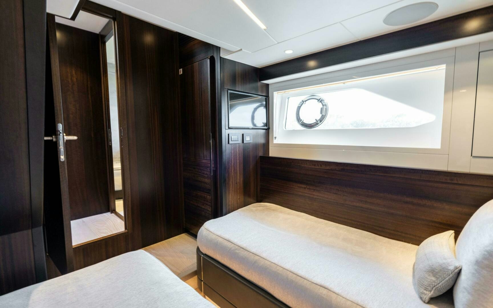 a room with a bed and a television aboard 4-PLAY VII Yacht for Sale