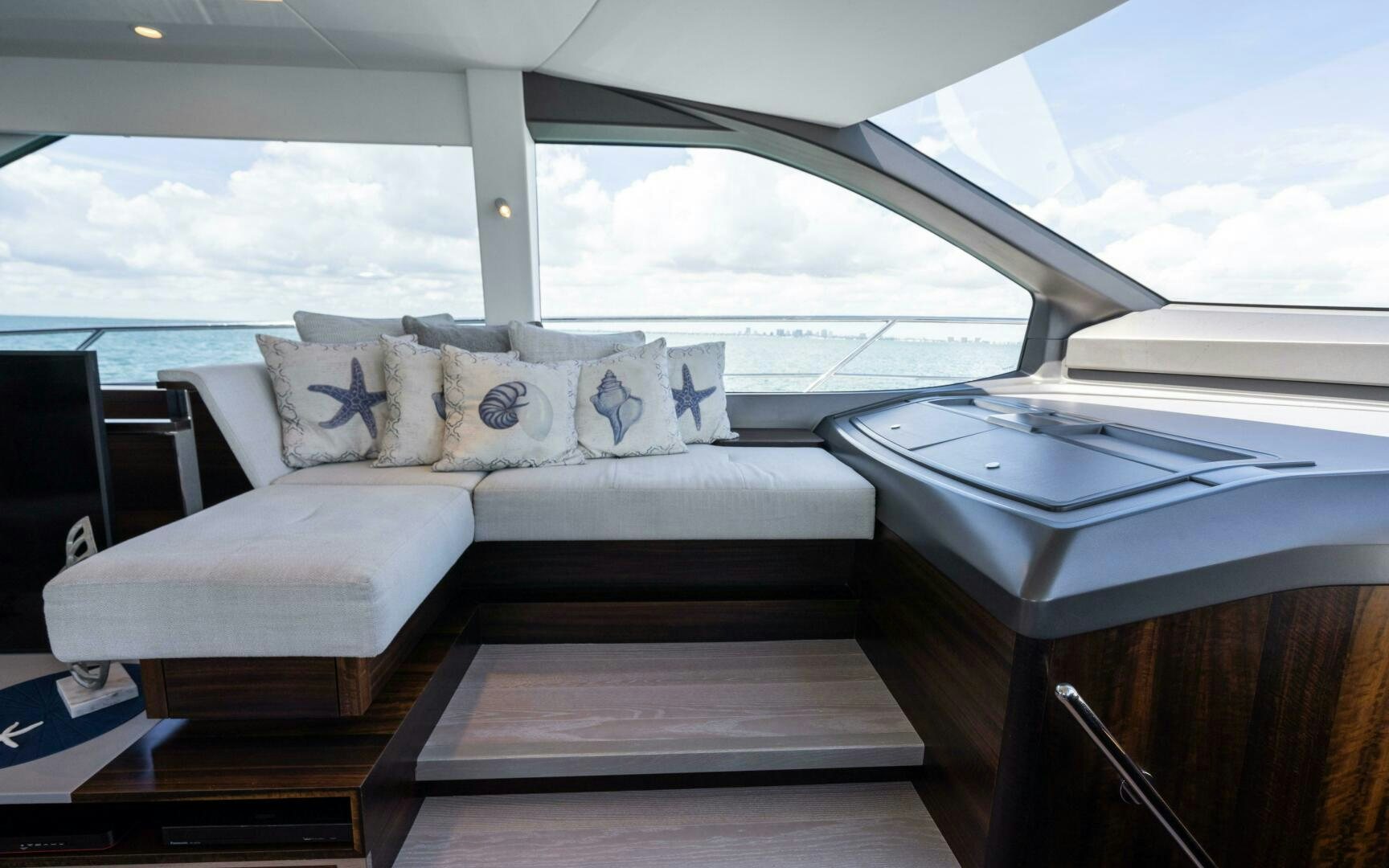 a white couch in a room aboard 4-PLAY VII Yacht for Sale