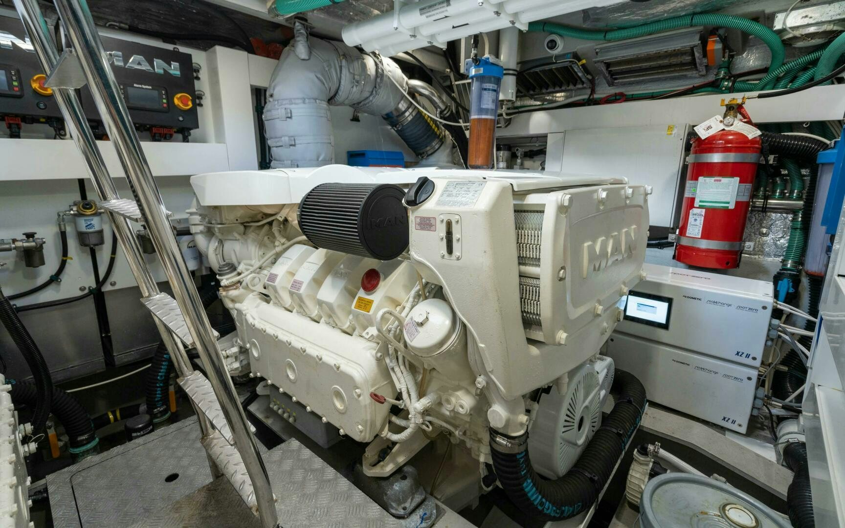 a white car with a large engine aboard 4-PLAY VII Yacht for Sale