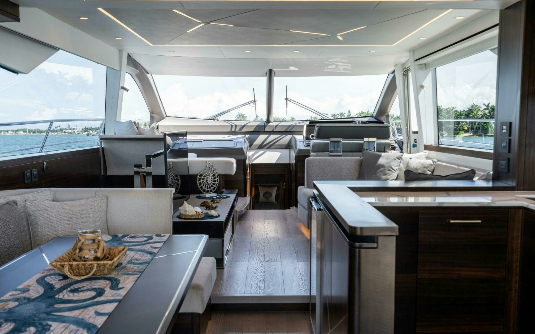 a room with a couch and a table aboard 4-PLAY VII Yacht for Sale