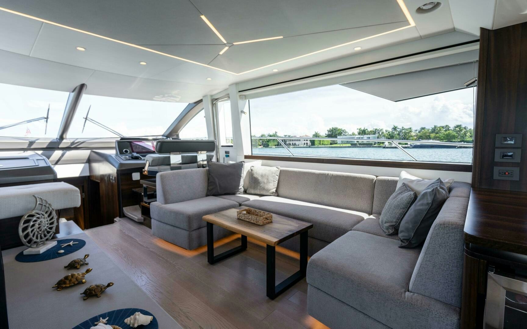 a living room with a couch and a table aboard 4-PLAY VII Yacht for Sale