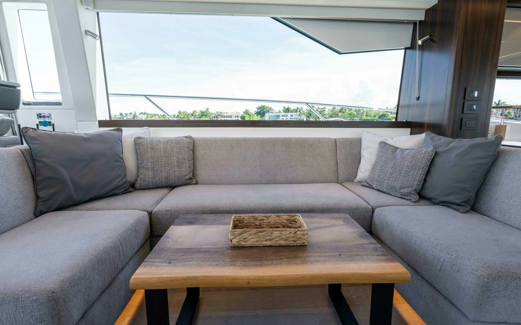 a couch and a table in a room aboard 4-PLAY VII Yacht for Sale